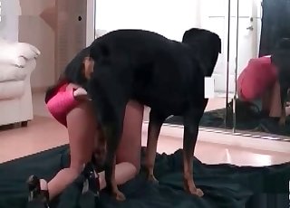 Tanned slag in pink fucks a hot pooch