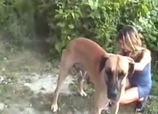 Zoophile gal fucks a dog while by the water