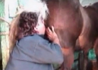Filthy woman giving a rim job to a handsome horse