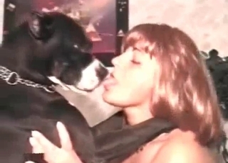 Naked whore is having some fun with a lovely black dog