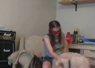 Masked musician and her trained dog