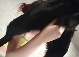 Redheaded Japanese girl eats dog ass